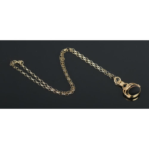 388 - A 9ct Gold onyx and agate swivel fob, on 9ct Gold chain. Total weight: 5.9g.