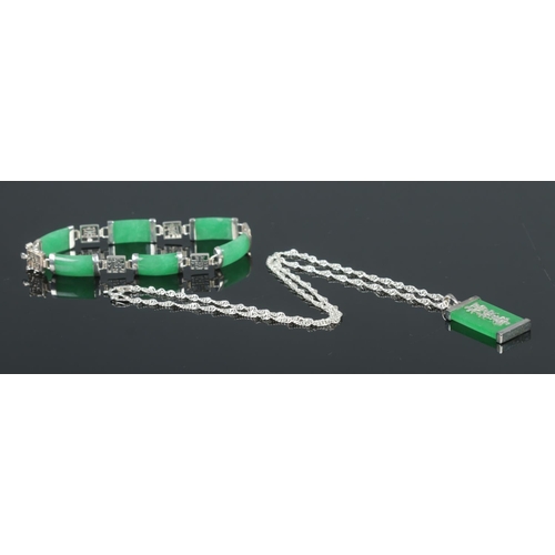 400 - Two pieces of jade coloured and silver jewellery, consisting of pendant on chain and panel bracelet,... 