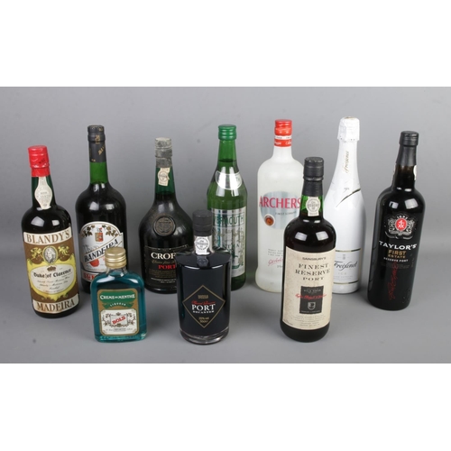 67 - A box of assorted sealed alcohol to include Blandys Madeira Duke of Clarence wine, Bandeira Superior... 