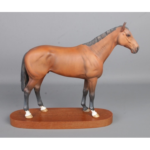 414 - A Beswick ceramic model of the racehorse 'Nijinksy'; winner of the Triple Crown 1970. Raised on oval... 