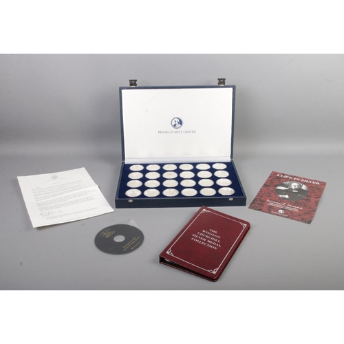 426 - Franklin Mint; 'A Life in Silver', The Winston Churchill Silver Medal Collection. A fitted case cont... 