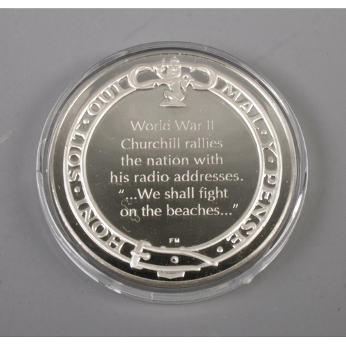 426 - Franklin Mint; 'A Life in Silver', The Winston Churchill Silver Medal Collection. A fitted case cont... 