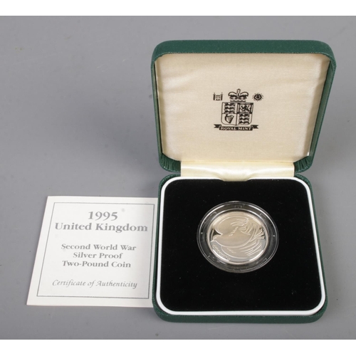 433 - Royal Mint, A 1995 Second World War commemorative silver proof two-pound coin in case with COA