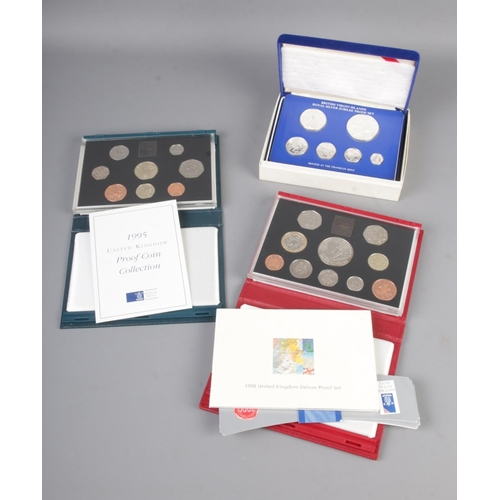 436 - Three cased proof coin collections including 2005 Craftsmanship in an age of technology, 1998 deluxe... 