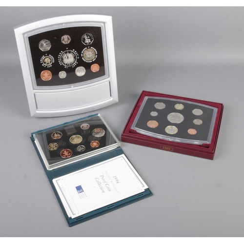 438 - Three cased proof coin collections including 1994 Craftmanship in an Age of Technology, 2002 Her Maj... 