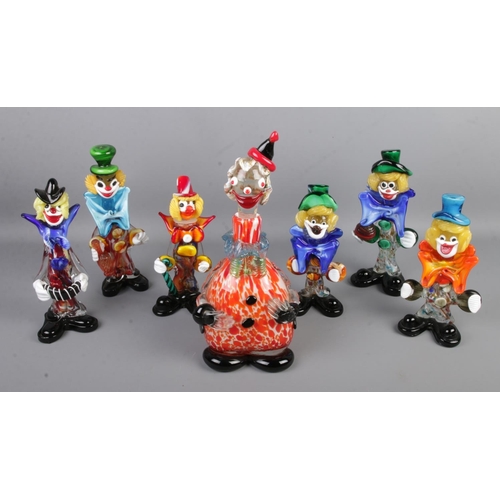 75 - A collection of seven Murano style glass clowns including large decanter example.