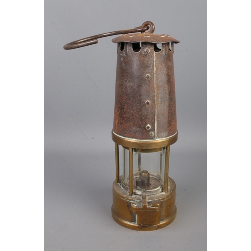 77 - A vintage brass miners lamp with glass marked British PLC.