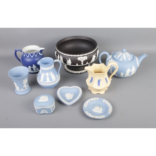 81 - A collection of Wedgwood jasperware ceramics to include black basalt fruit bowl, blue teapot, jugs, ... 