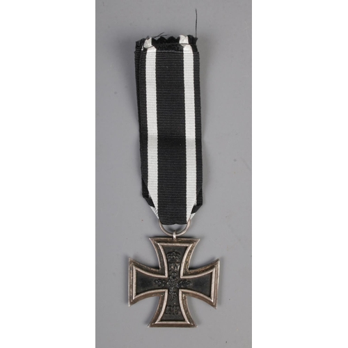 466 - An Imperial German Military First World War iron cross medal with ribbon.