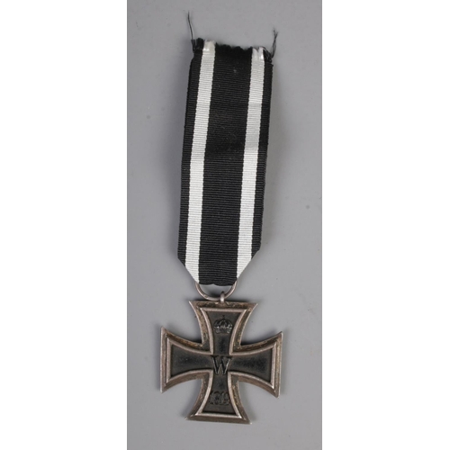 466 - An Imperial German Military First World War iron cross medal with ribbon.