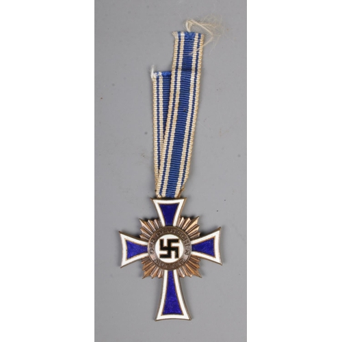 467 - German WW2 Cross Of Honour Of The German Mother Bronze with ribbon. This award was instituted on 16 ... 