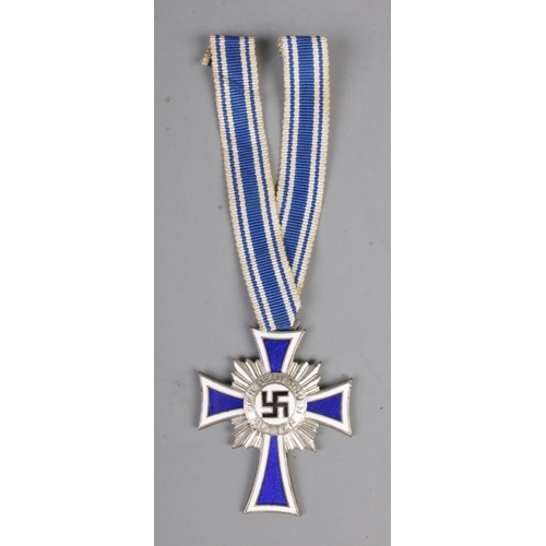 468 - German WW2 Cross Of Honour Of The German Mother Silver with ribbon. This award was instituted on 16 ... 