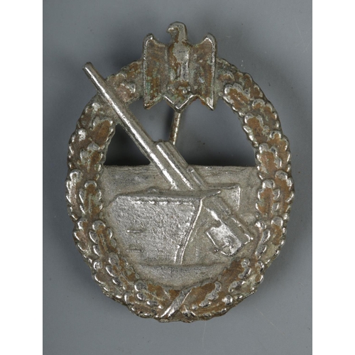 477 - A WWII German Naval Coastal Artillery badge with Schwerin Berlin to back