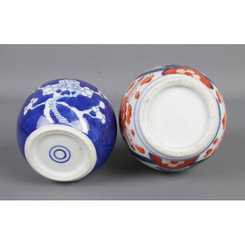 83 - A collection of oriental ceramics to include Imari bottle vase, pair of tea bowls and small ginger j... 