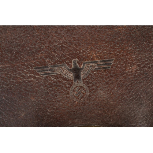 493 - A WW2 era leather satchel/briefcase having embossed eagle swastika stamp to front.