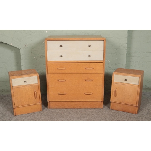 496 - A mid-century G-Plan E. Gomme bedroom chest of five drawers, together with a matching pair of bedsid... 