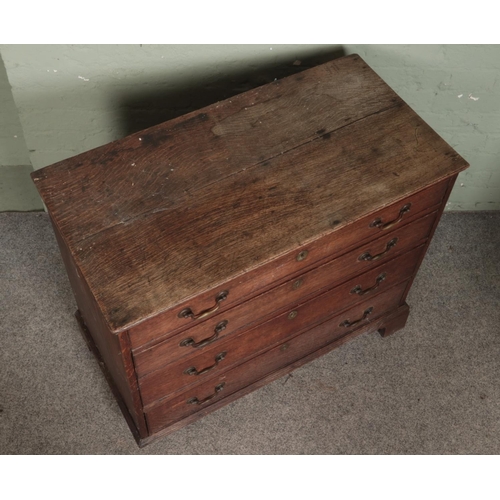 500 - A Georgian oak small chest of four drawers featuring brass swan neck handles and escutcheons. Approx... 