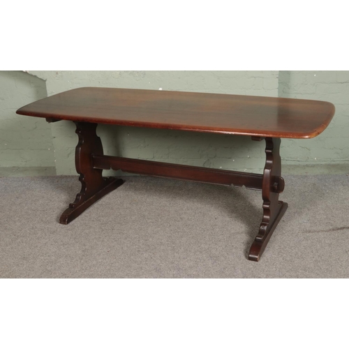 503 - An Ercol 'Old Colonial' refectory table and set of six chairs including two carver examples. Approx.... 