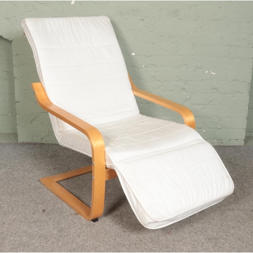 508 - An IKEA easy chair, with bent oak veneer frame.