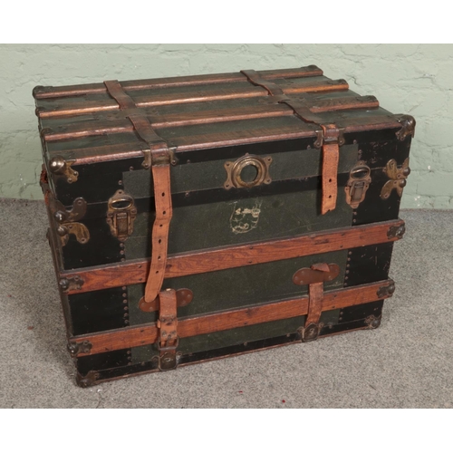 515 - A large wood bound steamer travel trunk