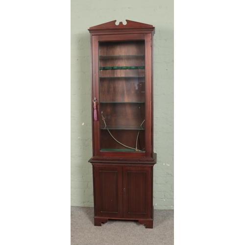 516 - A mahogany gun/display cabinet featuring four glass shelves and lower cupboard. Approx. dimensions 2... 