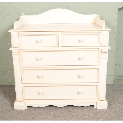 526 - A white painted two over three chest of drawers. Approx. dimensions 105cm x 59cm x 100cm.