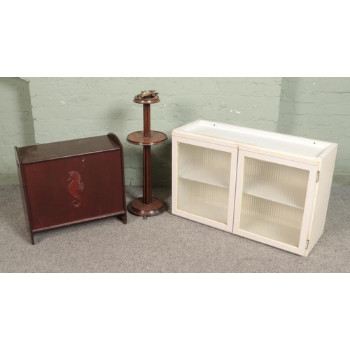 529 - A white painted cabinet with glazed front with a wooden trunk with seahorse decoration to front and ... 