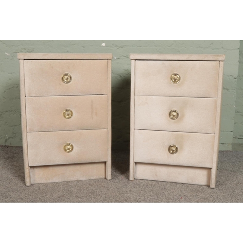 530 - A pair of velvet covered bedside chest of the three drawers, with ring pull handles. Height: 61cm, W... 