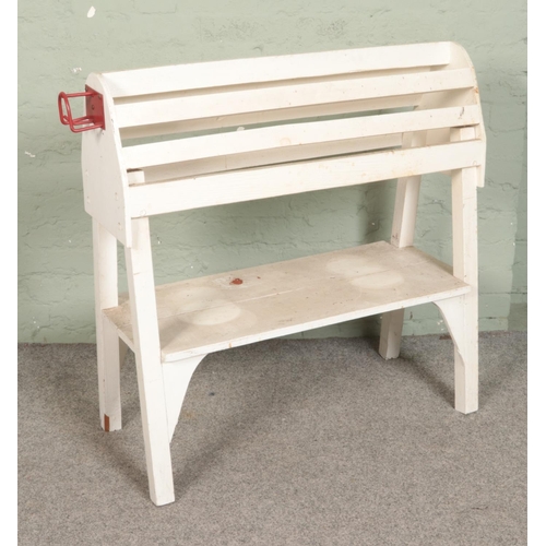 541 - A painted saddle rack/tack stand featuring single lower tier. Approx. dimensions 95cm x 40cm x 97cm.