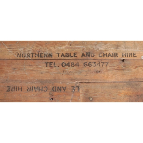 542 - A folding pine topped trestle table bearing stamp for Northern Table and Chair Hire to top. Approx. ... 