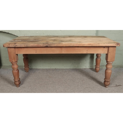 543 - A pine farmhouse style table with single drawer to each end. Approx. dimensions 193cm x 91cm x 81cm.