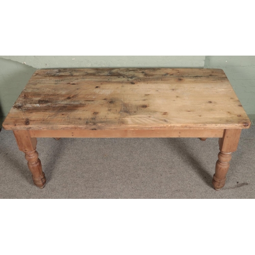 543 - A pine farmhouse style table with single drawer to each end. Approx. dimensions 193cm x 91cm x 81cm.