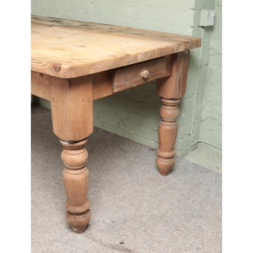 543 - A pine farmhouse style table with single drawer to each end. Approx. dimensions 193cm x 91cm x 81cm.