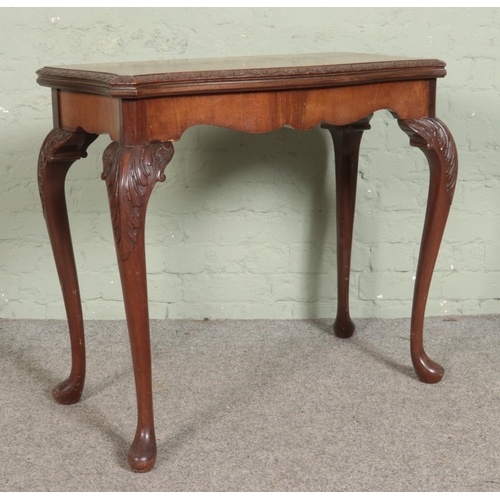 550 - A Maple & Co mahogany fold over card table. Raised on cabriole supports. Bearing Maple Quality label... 