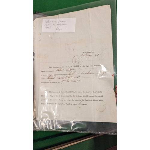 455 - A folder holding a collection of war time militaria including Hitler Youth documents, cuff titles, f... 