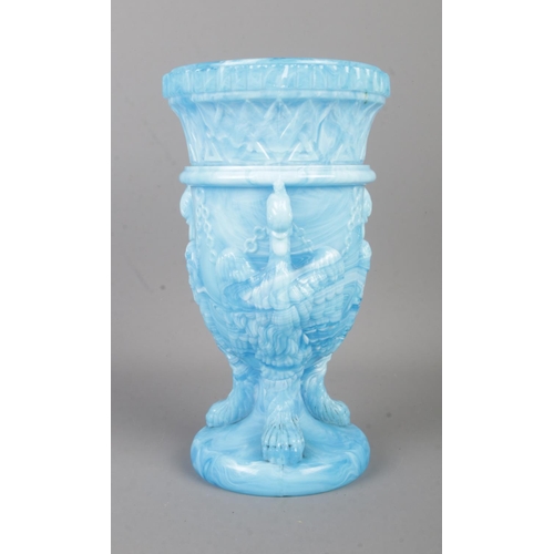 100 - An Edward Moore & Co. pressed glass vase in the 'Chained Swan' pattern. Formed as three chained bird... 