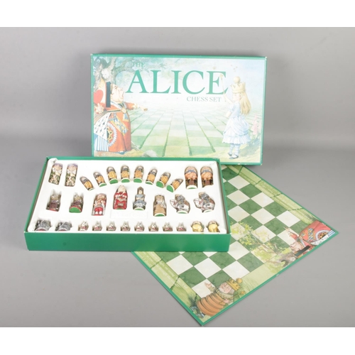 103 - A boxed and complete The Alice Chess Set by MPL Gifts & Games.