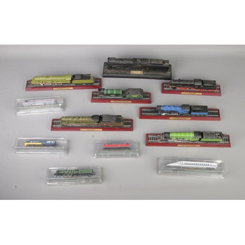 112 - A collection of display model locomotives to include several boxed Del Prado examples and coal made ... 