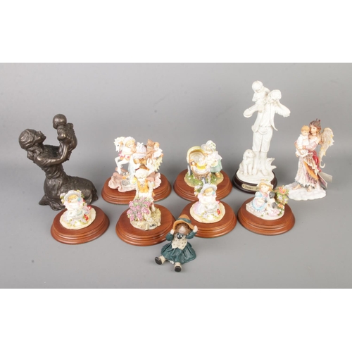 113 - A collection of assorted resin figures to include Leonardo collection and Small World.