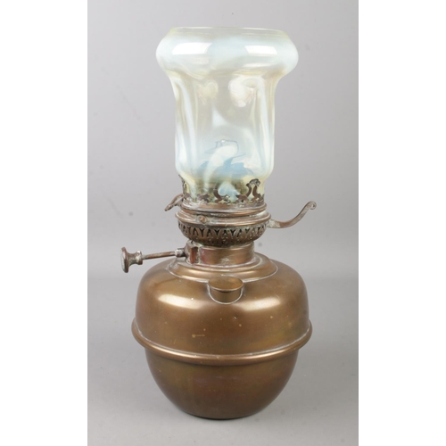 120 - A Veritas oil lamp with vaseline glass shade.