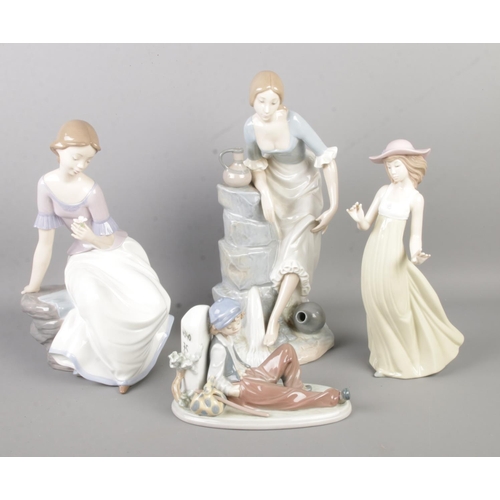 121 - Four ceramic figures and figure groups, produced by Lladro and Nao by Lladro. To include 'Time to Re... 