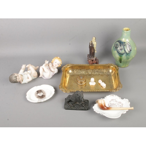 123 - A quantity of assorted collectables to include Piano Babies figures, ceramic pipe tray, embossed bra... 