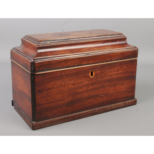 124 - A 19th century mahogany tea caddy.