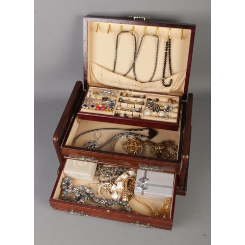 131 - A vintage jewellery box featuring contents of costume jewellery to include Skagen earrings, bracelet... 