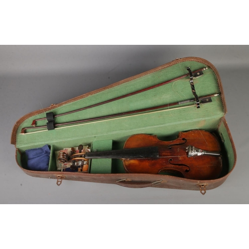 132 - An antique one piece back violin in case with accessories