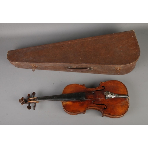 132 - An antique one piece back violin in case with accessories