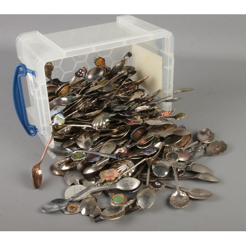 133 - A large quantity of mainly silver plated souvenir spoons.