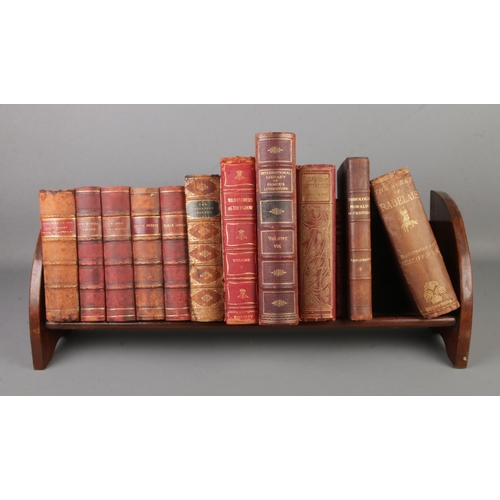 136 - A quantity of antique books in a book trough including The Works of Rabelais, Theologia Moralis St P... 