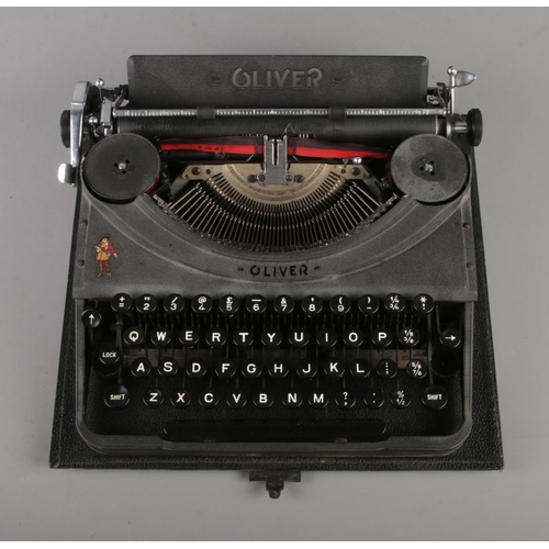 147 - A mid-century Oliver portable typewriter, in case. Bears Oliver Cromwell figure to the body.