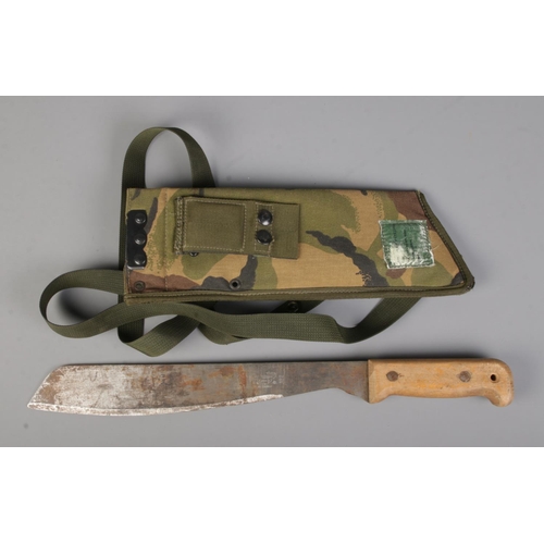 15 - A British military Martindale No.2 Golok machete bearing broad arrow mark to blade. Includes later c... 